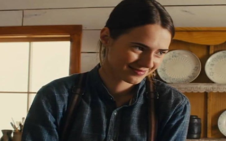 Caren Pistorius smiling in a blue shirt.